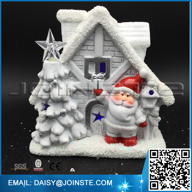 Red gray santa and tree with christmas lighted houses