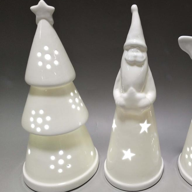 White ceramic christmas tree and santa figurine with LED light inside